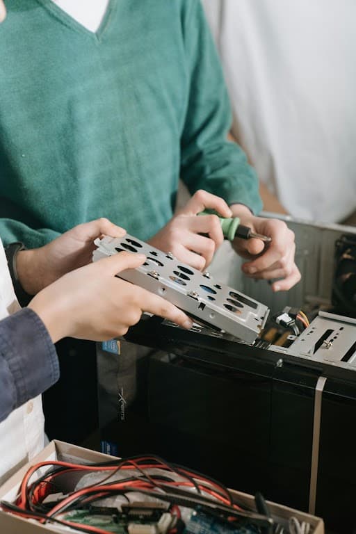 Technician repairing computer hardware